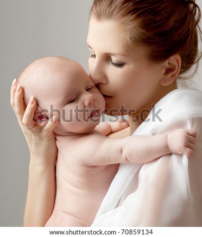 happy mother with baby over white