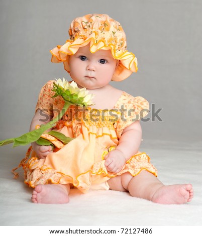 Beautiful Baby Girl Clothes on Baby In A Beautiful Dress With A Sunflower Stock Photo 72127486