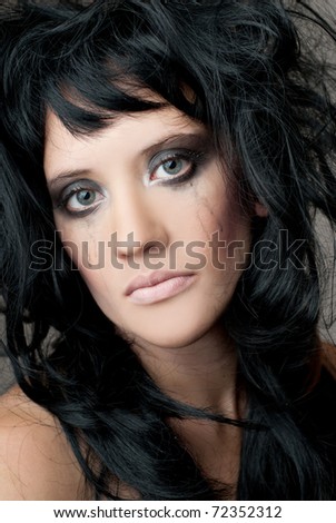 Sad woman face with smeared makeup