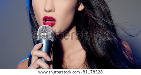 Female singing into mic