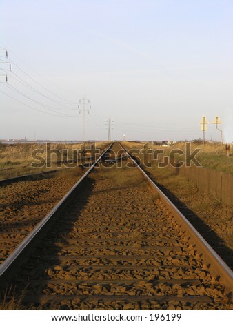 An empty railway track running in to nowhere