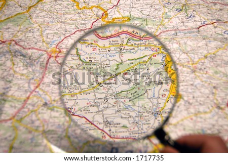 Planning of a journey. Map, magnifier.