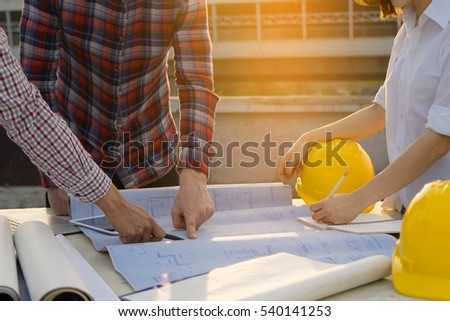 Image of Hands of architect engineer meeting for architectural project. working with partner and blueprint on table. selective focus, Teamwork Concept.