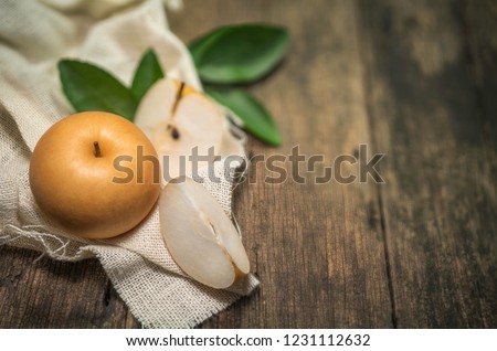 Snow pear or Korean Snow pear fruits on wooden background,Snow pear or Fengsui pear on a wooden background delicious and sweet,