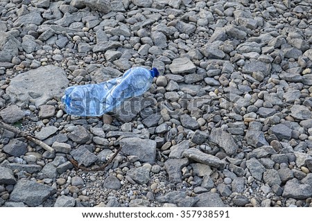 Plastic bottle on the shore plastic ocean  trash  beach  sea  environmental  dirt  water  shore  pollute  dirty  river  recycling  bottle  unhygienic  danger  pollution  polluted  ecology