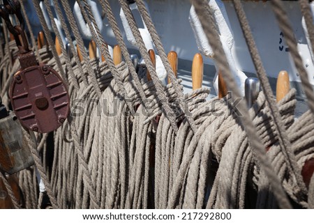 Rope control the sails, tied to a wooden beam