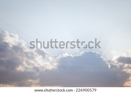 Sun rays streaming through the clouds