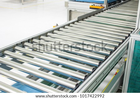 The conveyor chain, and conveyor belt on production line set up in clean room area.
