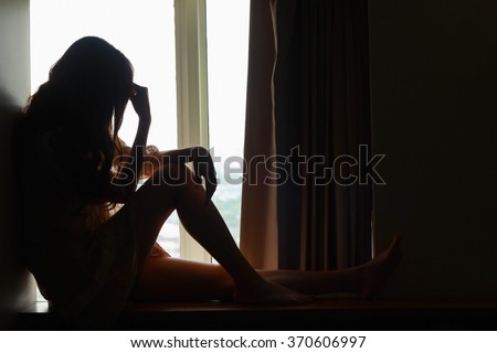 Broken hearted woman is crying,silhouette,Valentines day concept.