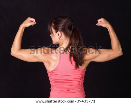 Woman body builder flexing