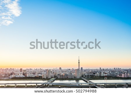 Business and culture concept - panoramic modern city skyline bird eye aerial view with tokyo skytree under dramatic sunset glow and beautiful cloudy sky in Tokyo, Japan