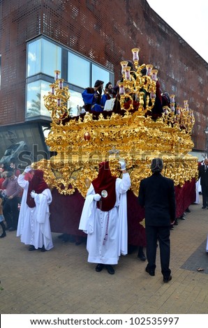 CORDOBA, SPAIN APRIL, 5: Penitents and unidentified people in the procession of the Holy Supper. On April 5 , 2012 in Cordoba