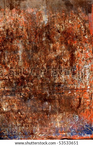A rusted steel surface with distressed blue and orange paint