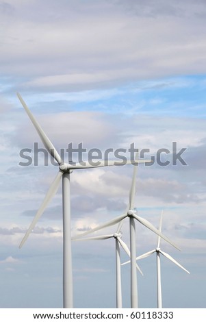 Four giant 2 megawatt wind turbines in sunlight