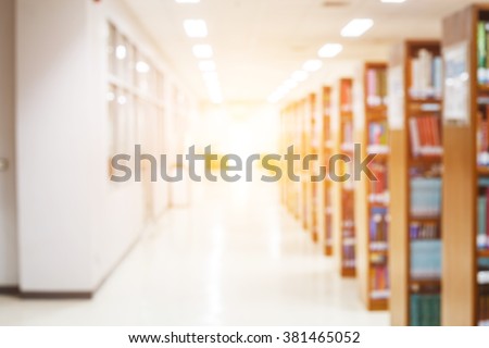 blur image of the library or Book shelf Knowledge and Research in Education. Library is a collection of sources of information and similar resources and sun light