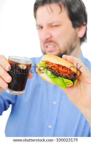 Save to a lightbox - stock-photo-unsatisfied-man-with-his-burger-and-coke-100023179