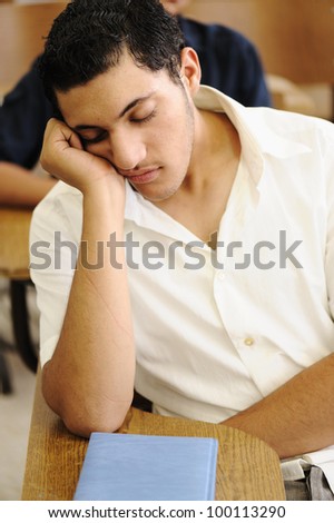 Teen student sleeping at lecture time, college