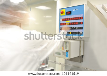 professional medical worker adjusting modern machine settings