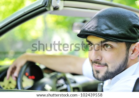 Handsome guy behind the wheel