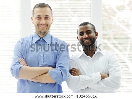 African American and Caucasian business man together