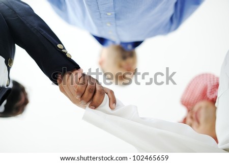 Closeup of business people shaking hands over a deal somewhere in the Middle east