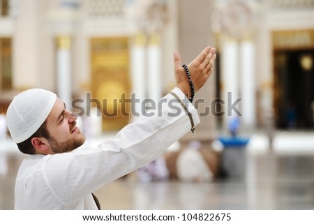 Muslim praying in Medina mosque outdoor