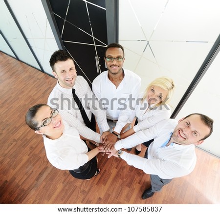 business colleagues with their hands stacked together