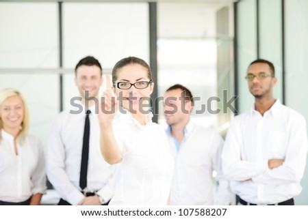 Business person pointing with finger on abstract digital button ready for your message (selective focus)