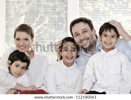 Happy family with kids on the couch