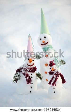 Happy family of snow people snowman