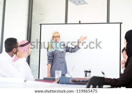 Arabic middle eastern woman having a business presentation with copy space board