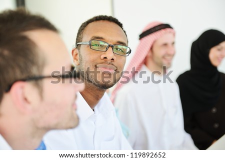 African american Arabic business man in a row with colleagues