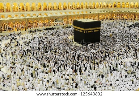 MECCA - JULY 21 : Pilgrims inside the Kaaba on July 21, 2012 in Mecca, Saudi Arabia.  Kaaba in Mecca is the holiest and most visited mosque for all Muslims.