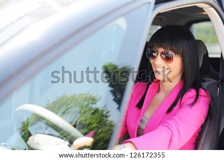 Business woman driving a car