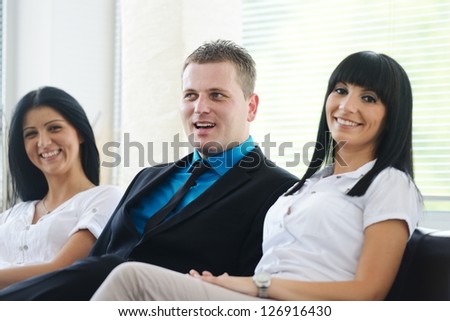 Portrait of satisfied business partners laughing during conversation