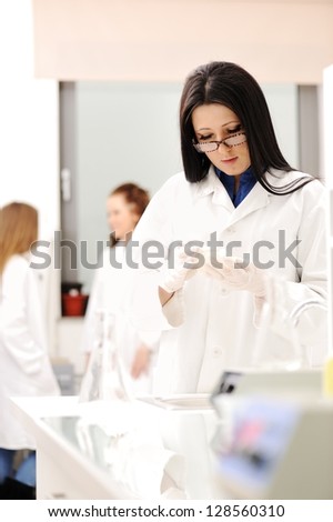 Young science workers research at medical lab