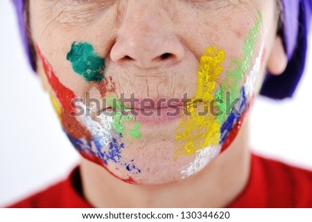 Elderly woman grandmother with painted face over white background