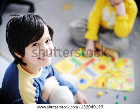 Two kids playing a game of cards