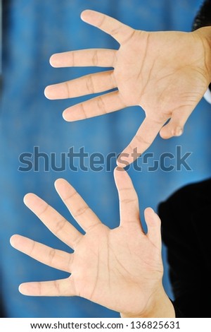 Handsome guy show hands with twelve fingers