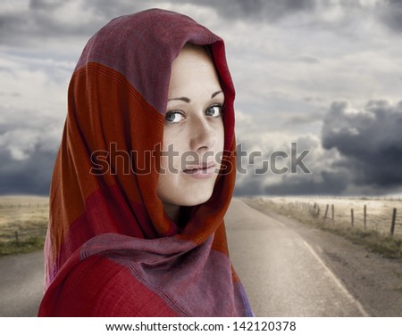 Young Arabic woman in wearing islamic scarf on the Way