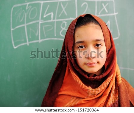 Cute lovely Arabic school children at classroom having education activities