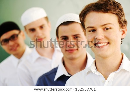 Multi ethnic group of teenage students inside the high school classroom posing on board