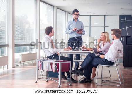 Business people sitting at corporate meeting