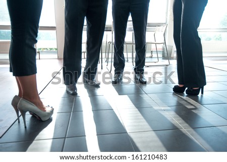 Modern corporate people legs in office