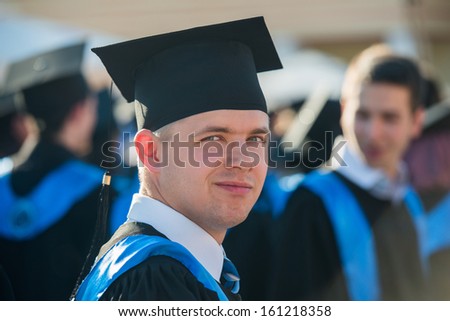 Male graduate student with graduation cap