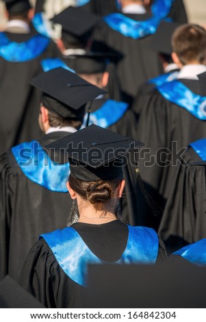 Rear view of a group of college graduates