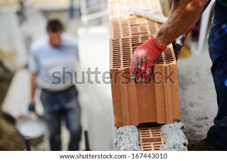 Worker Building On Wet Layer Concrete, Brick Wall
