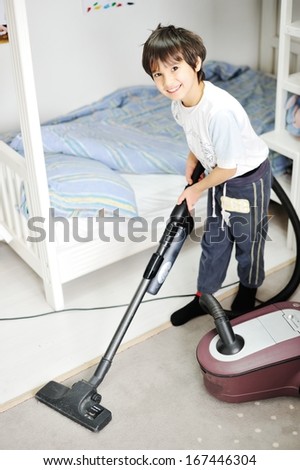 Kid Using Vacuum Cleaner In His Room