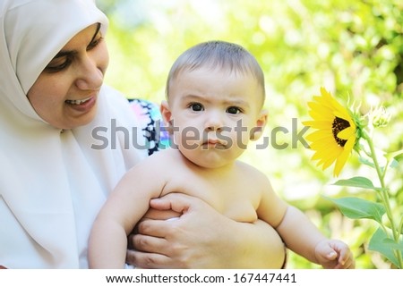 Arabic mother with baby in beautiful nature