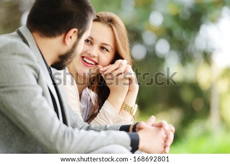 Lovely couple enjoying fall in love at park